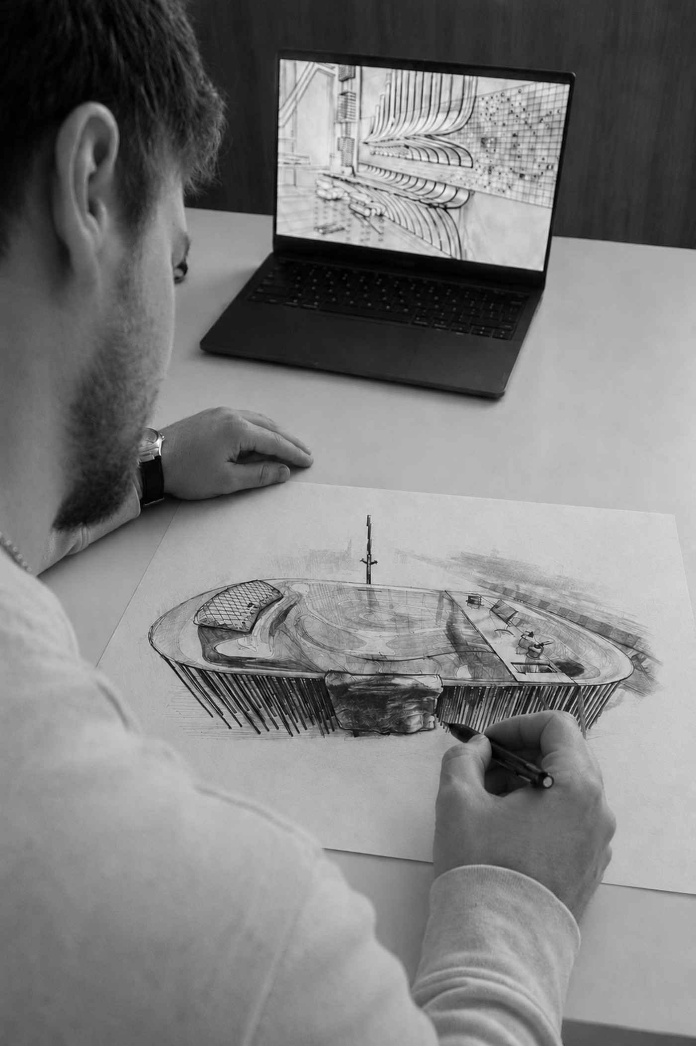 Louis Menu en train de dessiner